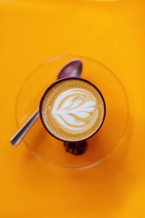 Top down coffee moment with warm tones and candid style, framed for social