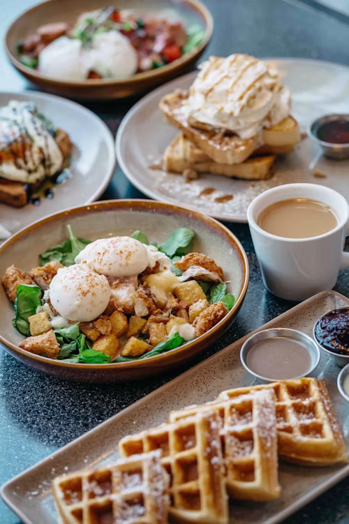 Brunch plate shot with natural light, photogenic composition, warm colour grade